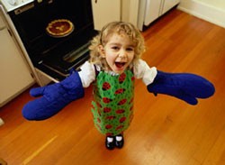 photo of girl with oven mitts on