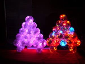 I glued them as a tree shape, put mini-lights inside and lit them up. - By Bobby T.